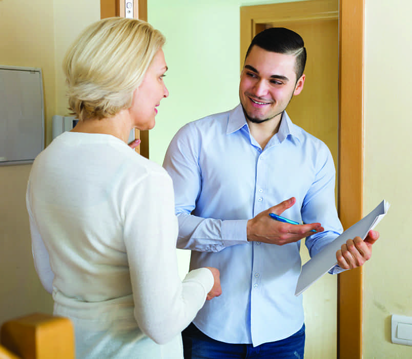 Man and woman discussing CVs