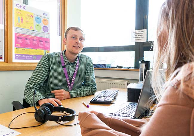Adult careers adviser offering advice to client